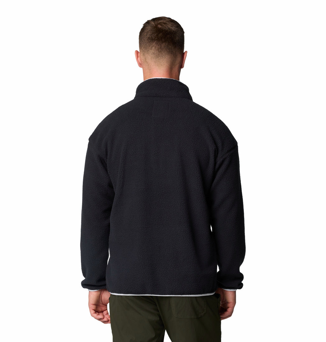 Man wearing a black fleece jacket on a white background