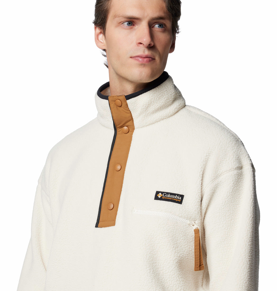 Man wearing a white fleece jacket with brown accents and Columbia logo on a white background
