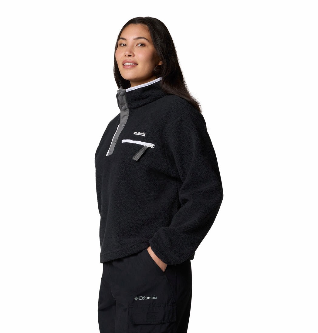Person wearing a black Columbia jacket on a white background