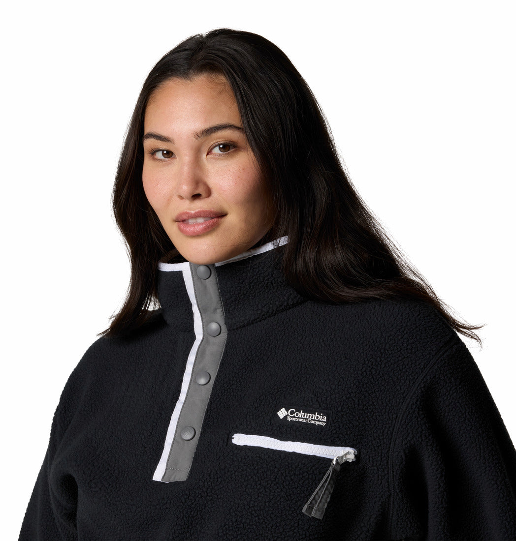 Woman wearing a black Columbia jacket on a white background