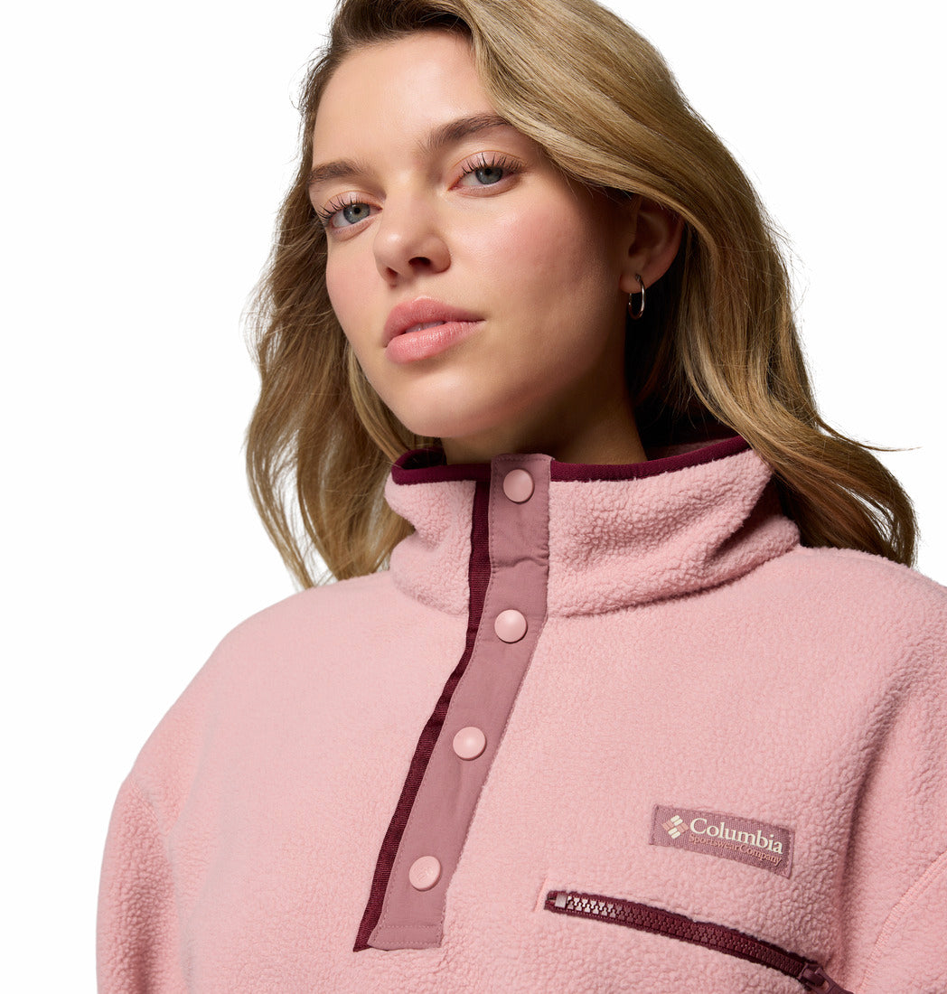 Woman wearing a pink Columbia jacket on a white background
