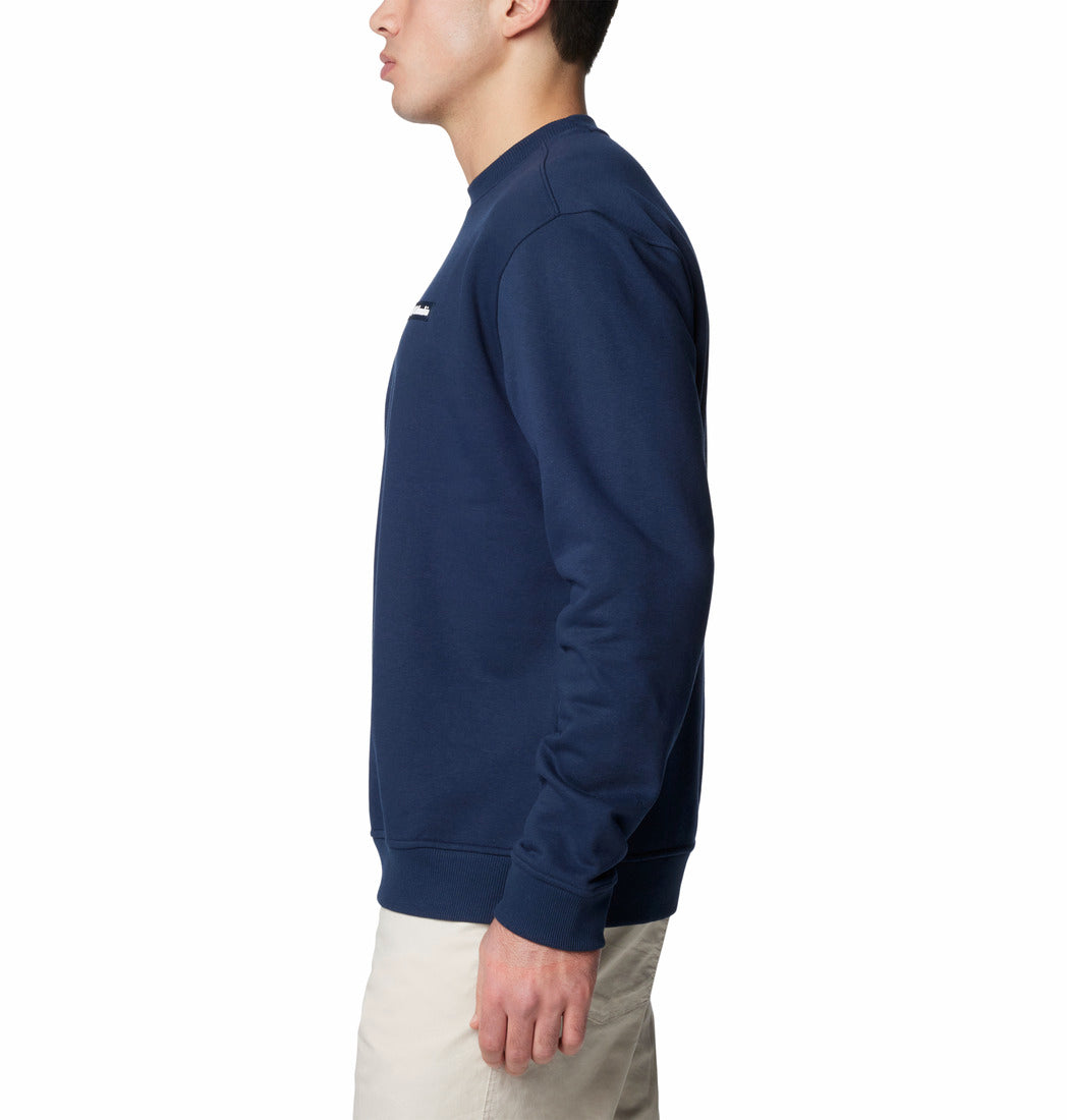 Person wearing a navy blue sweatshirt on a white background
