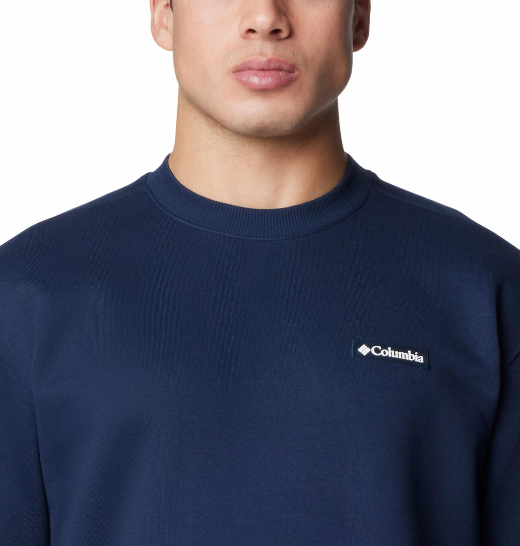 Navy blue sweatshirt with Columbia logo worn by a person on a white background