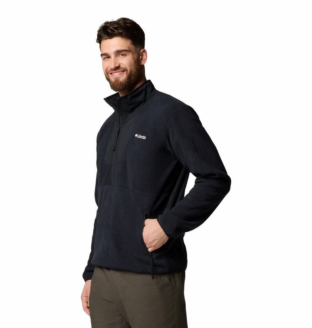 Man wearing a black fleece jacket with Columbia logo on a white background
