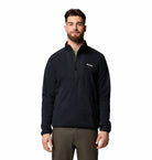 Man wearing a black pullover with Columbia logo on a white background