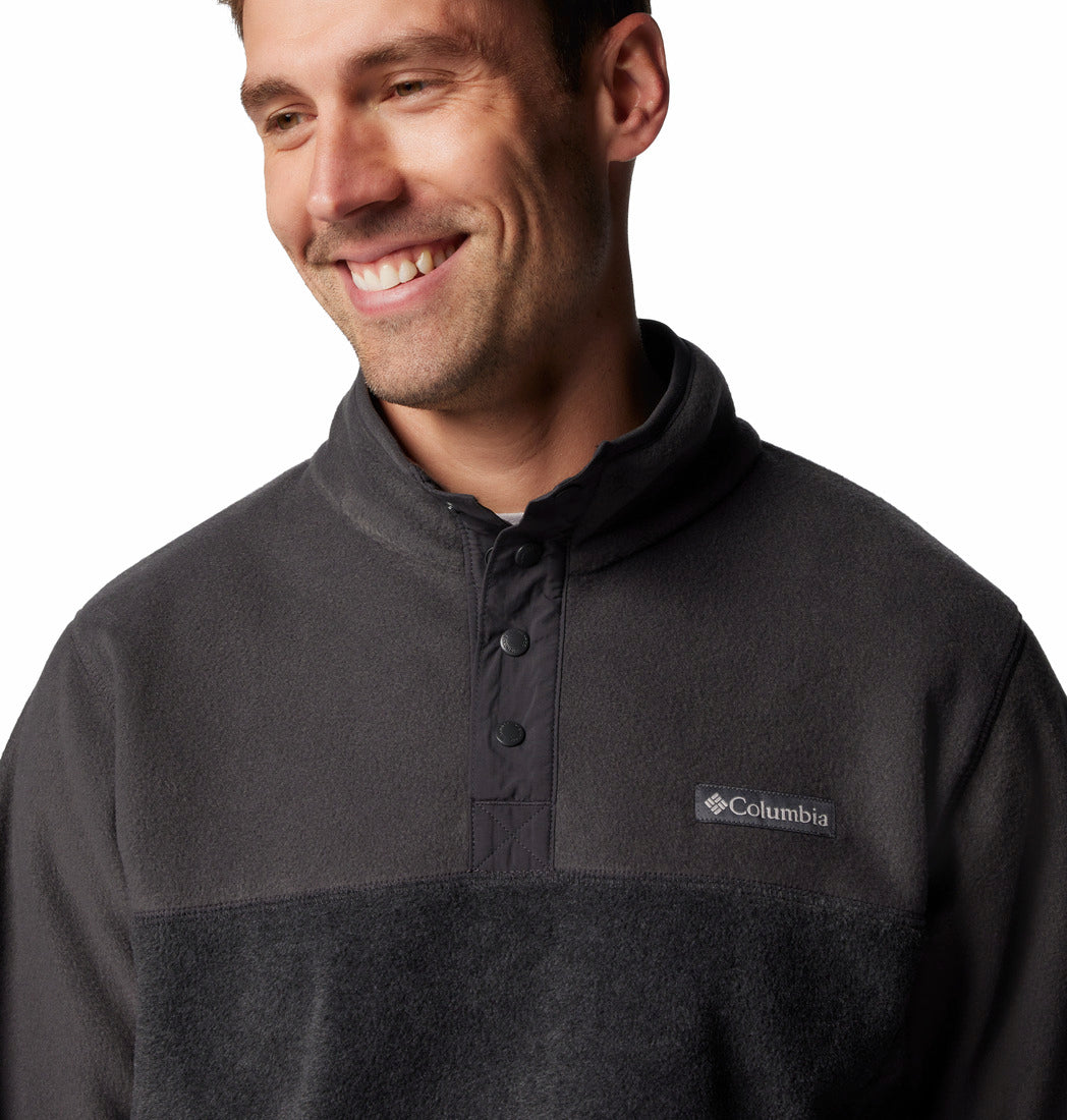 Man wearing a Columbia pullover with a white background