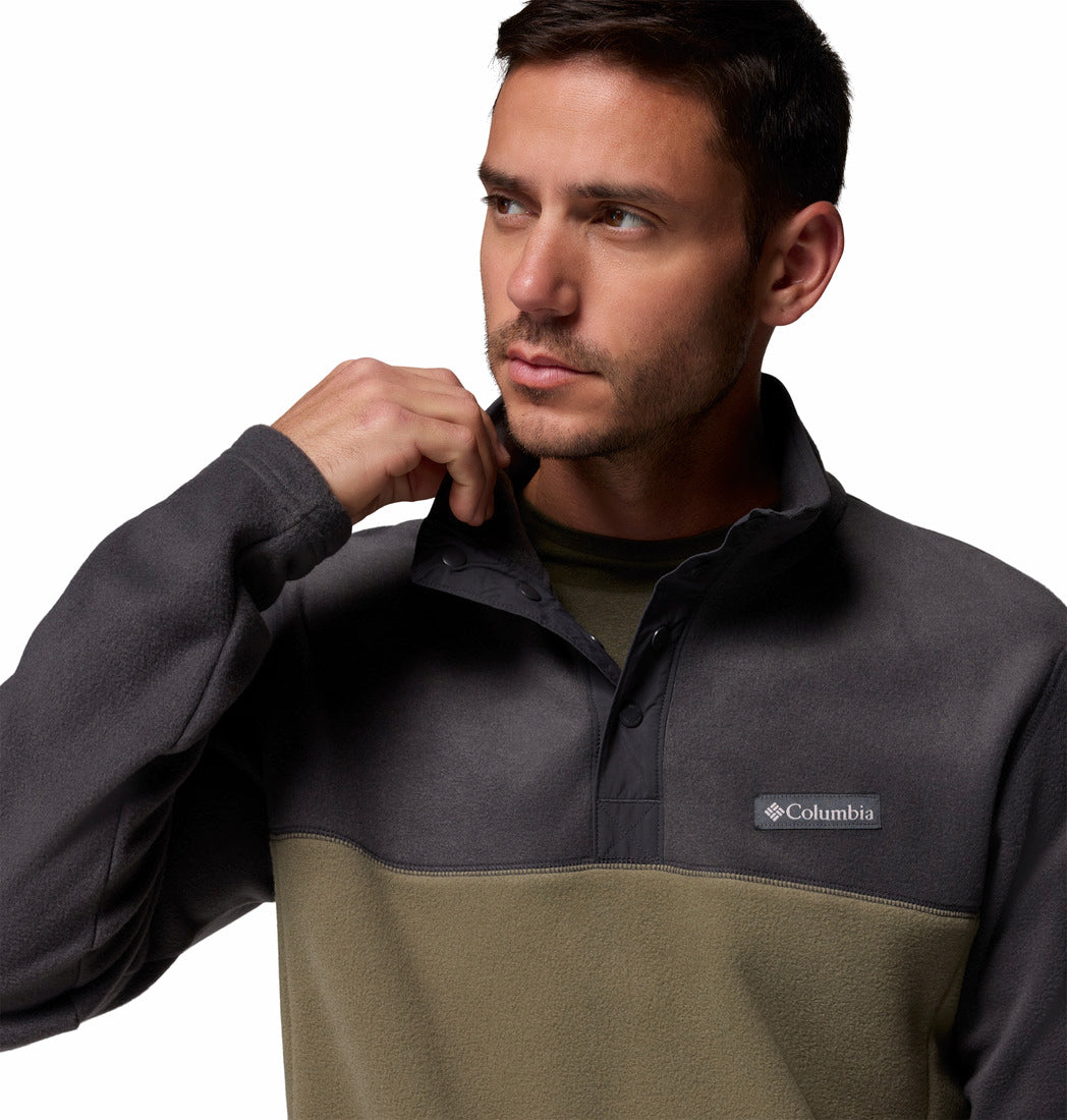 Man wearing a Columbia two-tone pullover with a white background
