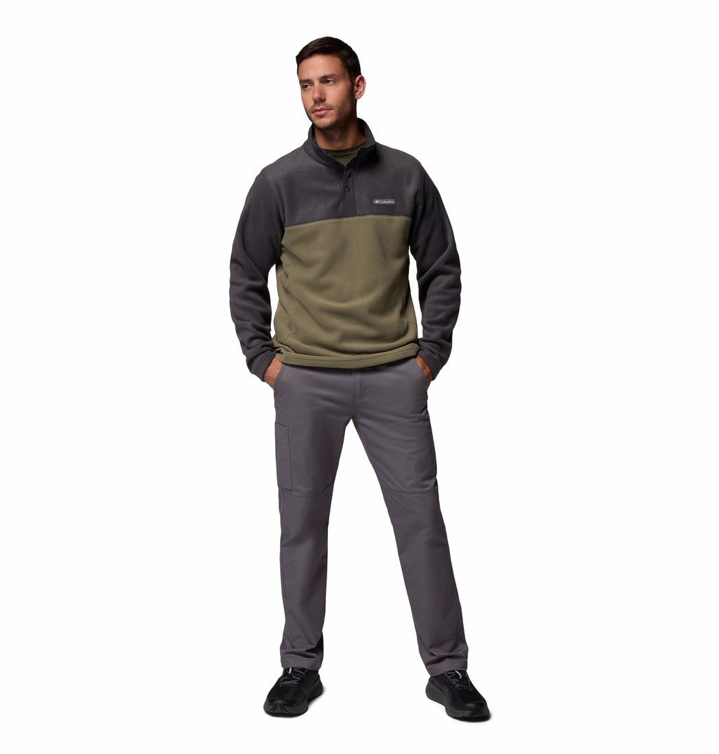 Man wearing a two-tone fleece pullover and pants on a white background