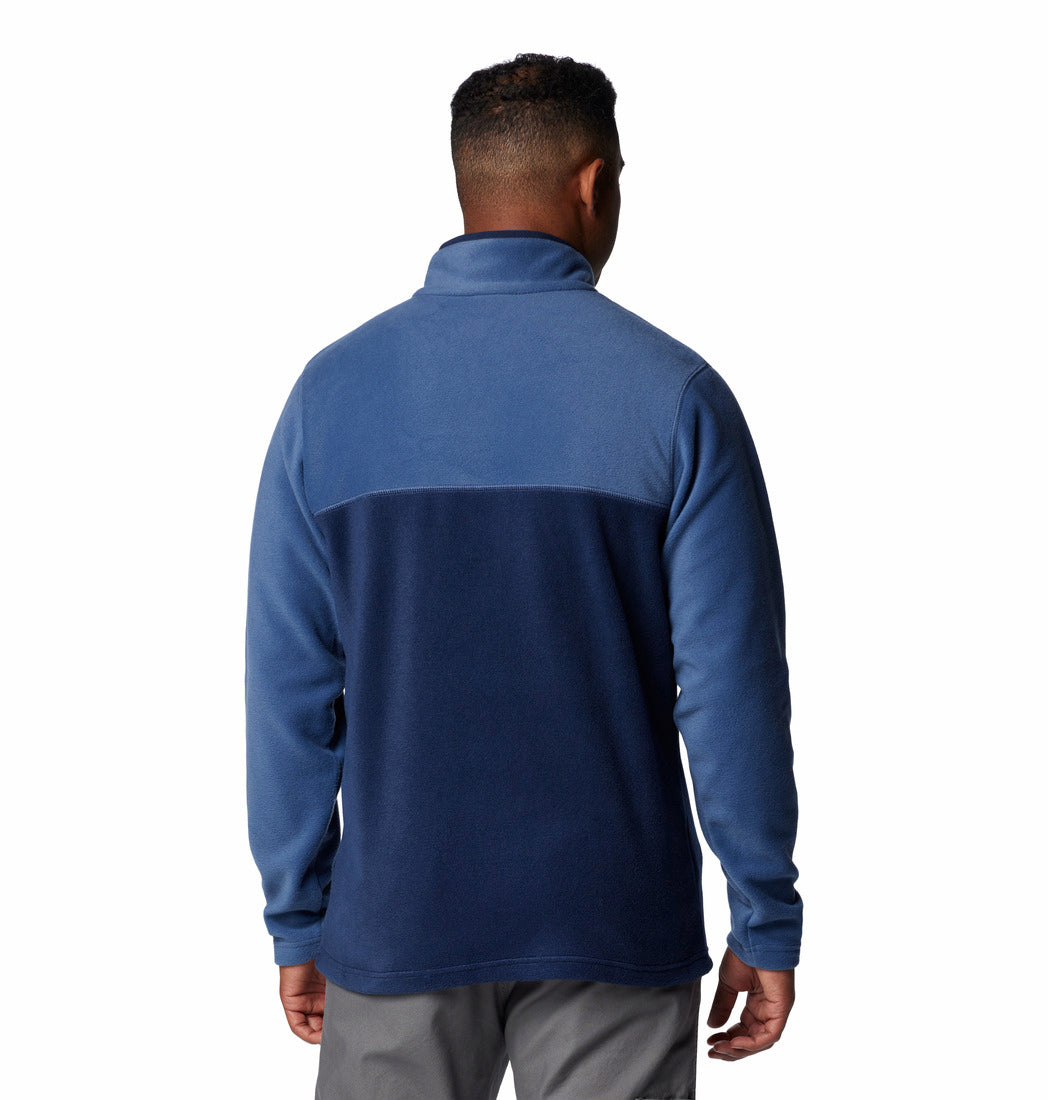 Man wearing a blue pullover with a white background