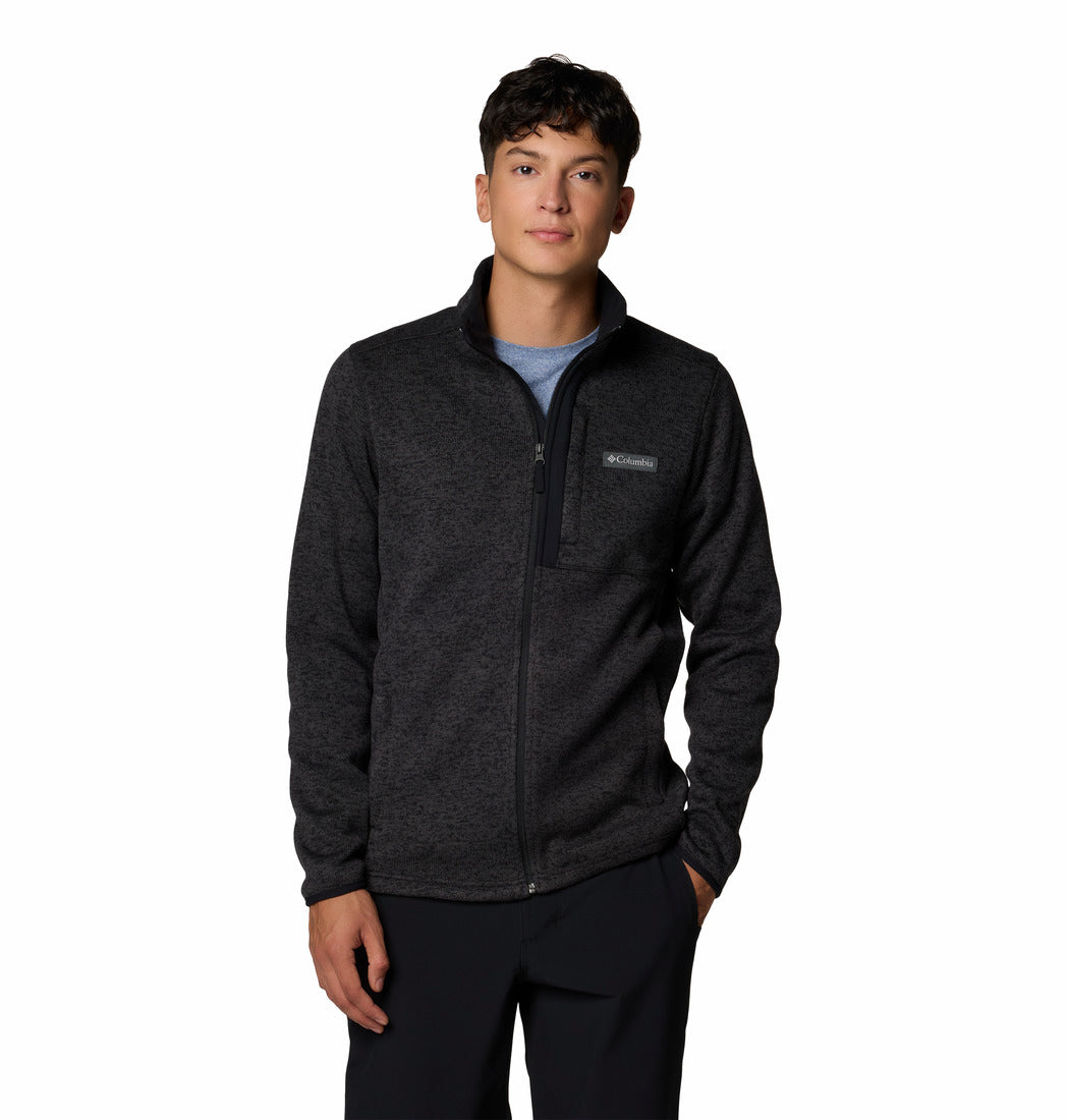 Person wearing a dark gray fleece jacket with a brand logo on a white background