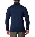 Person wearing a blue fleece with a white background