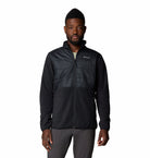 Man wearing a black jacket with a brand logo on a white background