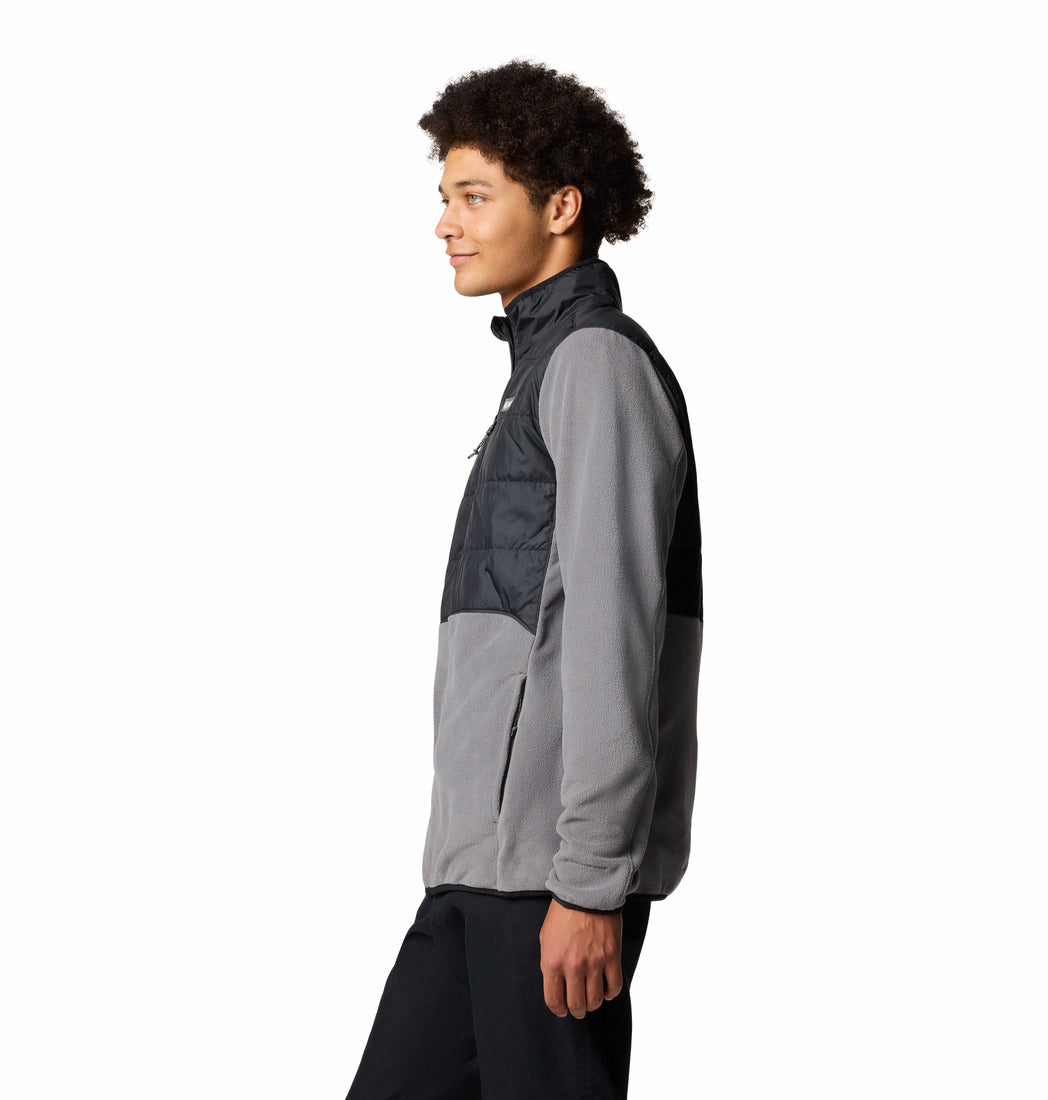 Person wearing a gray and black jacket on a white background