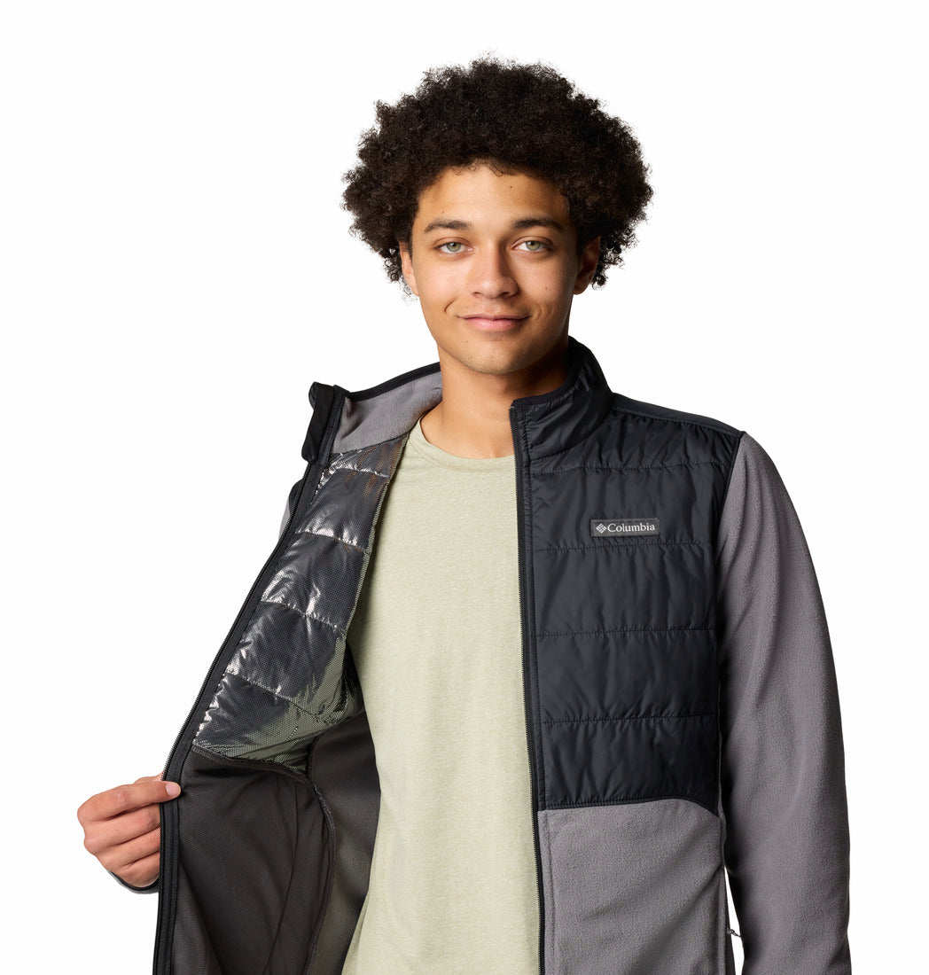 Person wearing a Columbia vest on a white background