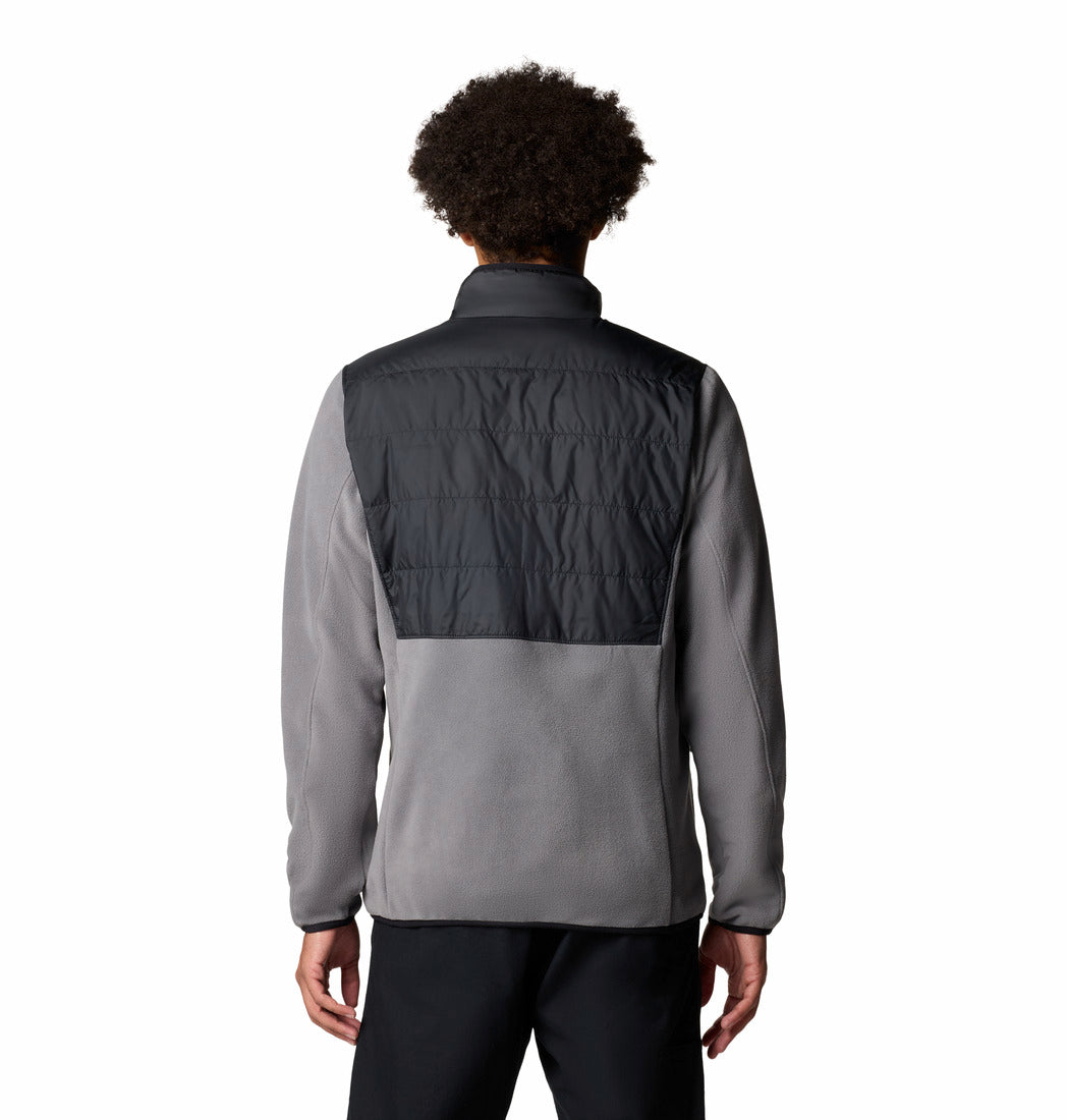 Person wearing a two-tone jacket with gray and black colors on a white background