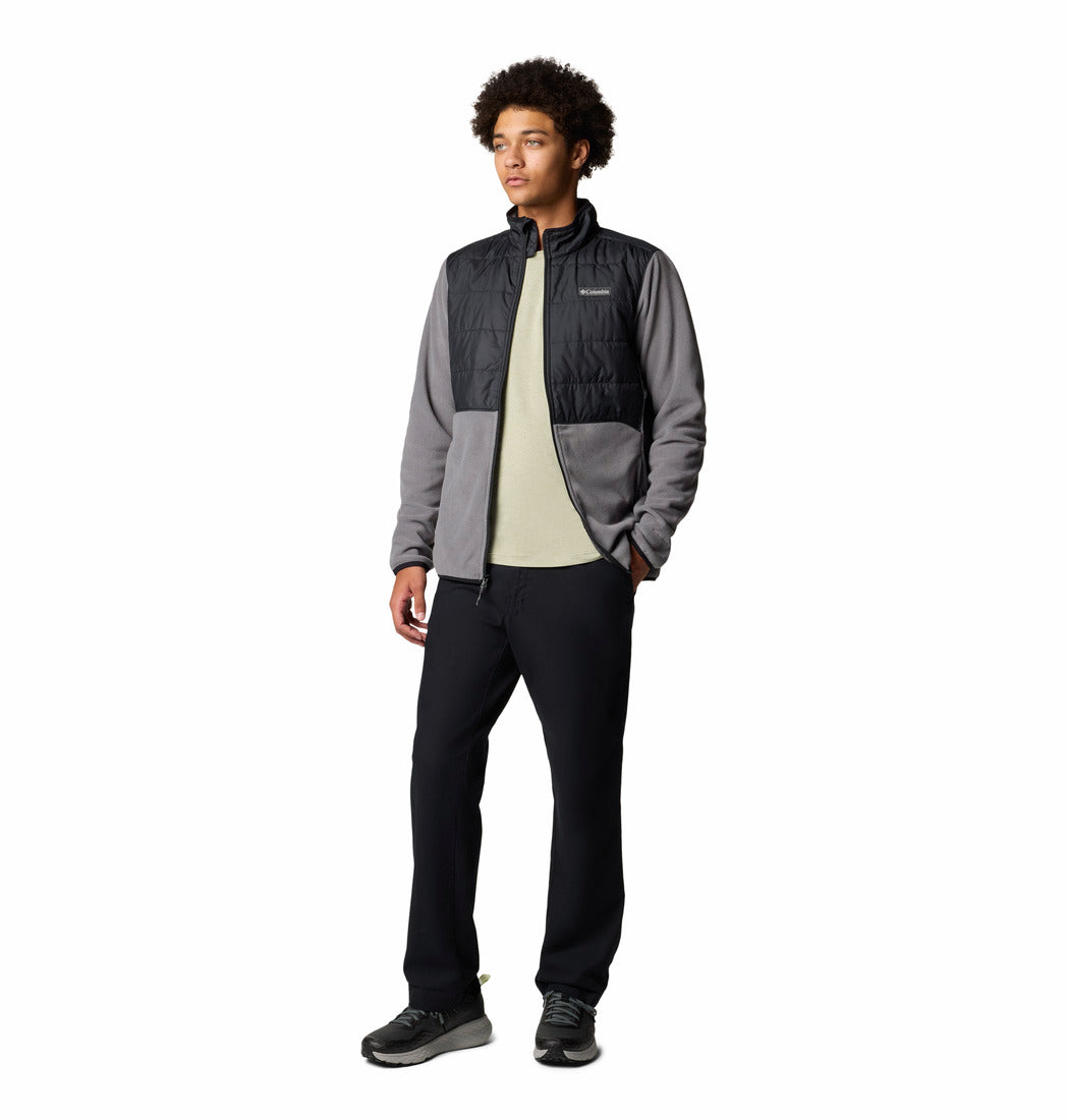 Person wearing a two-tone jacket with a white background