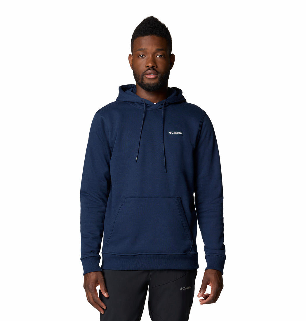 Man wearing a navy blue hoodie with Columbia logo on a white background