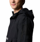 Columbia Mens Challenger Windbreaker Anorak in black, detail view of sleeve zip pocket and mesh panel.