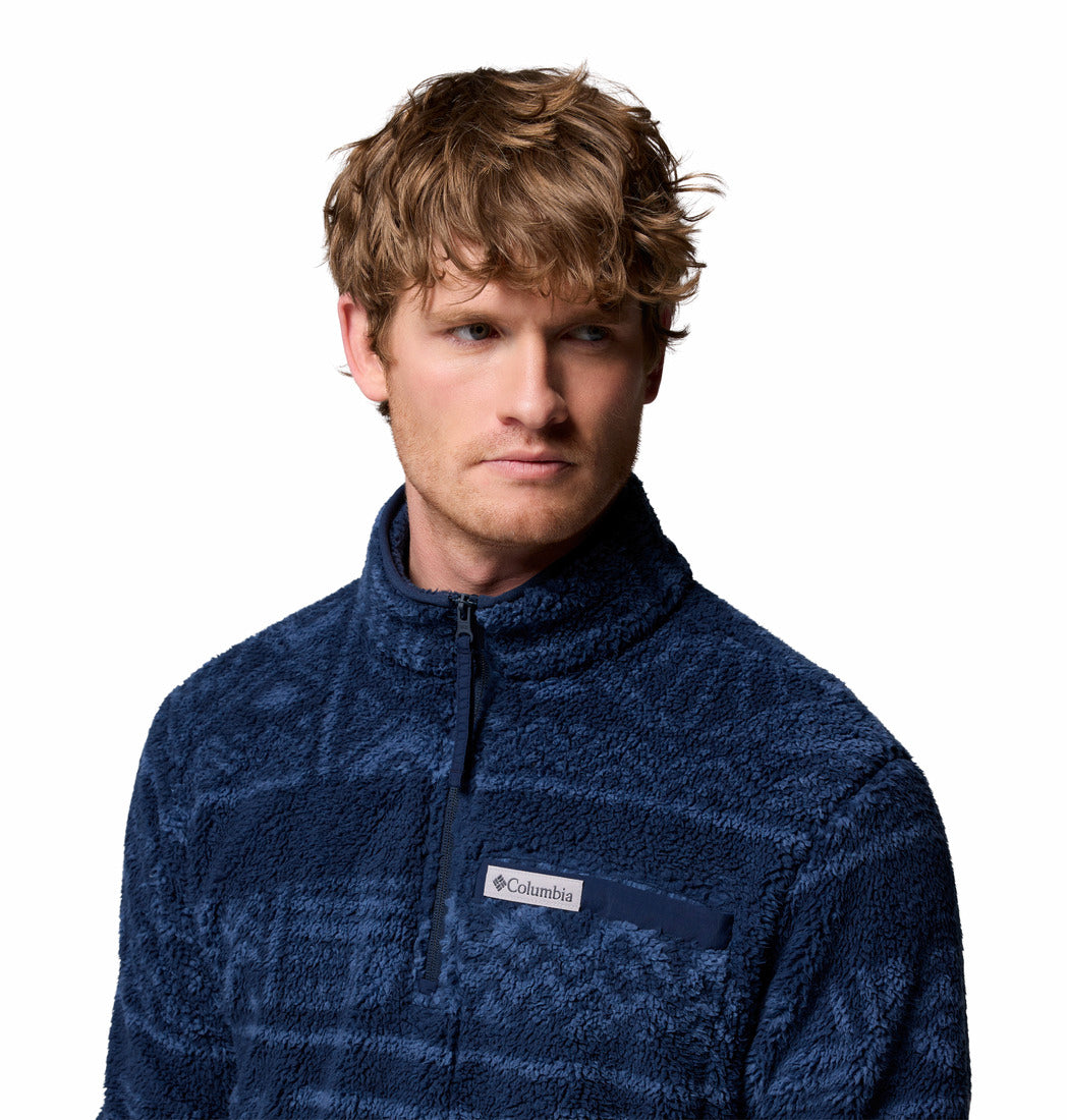 Man wearing a blue Columbia fleece jacket on a white background