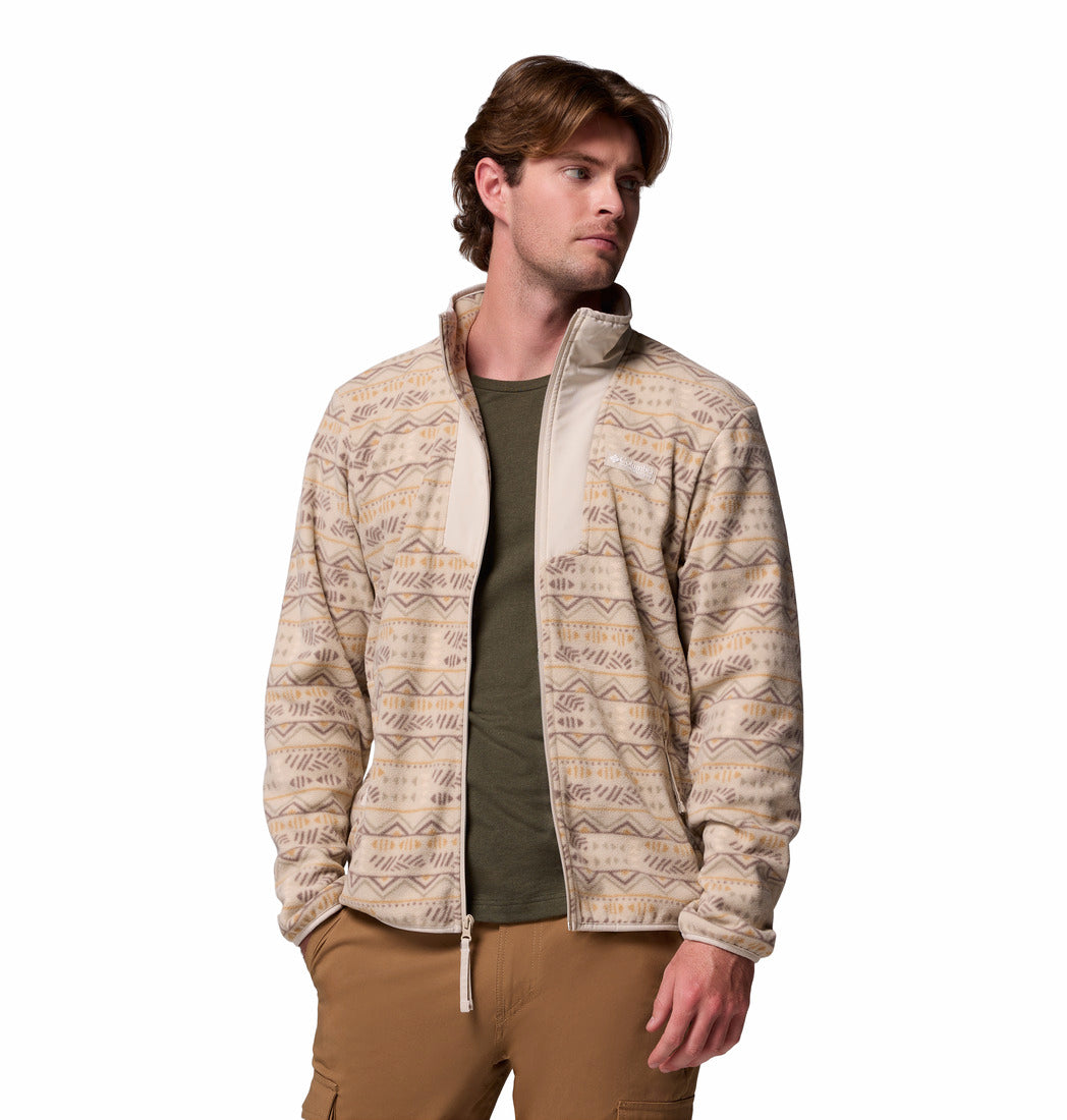 Man wearing a patterned jacket on a white background