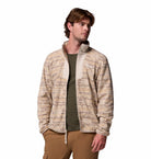 Man wearing a patterned jacket on a white background