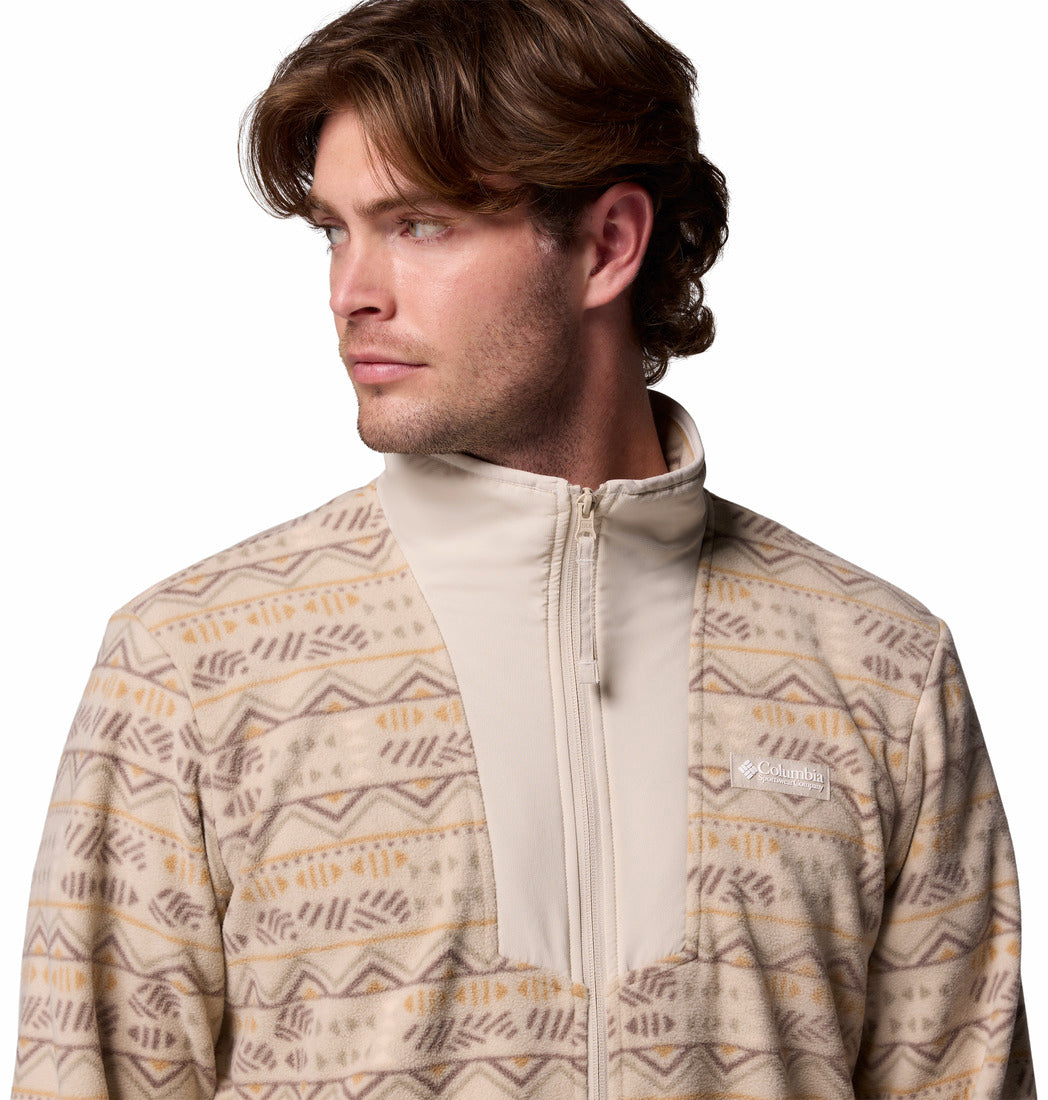 Man wearing a patterned jacket on a white background