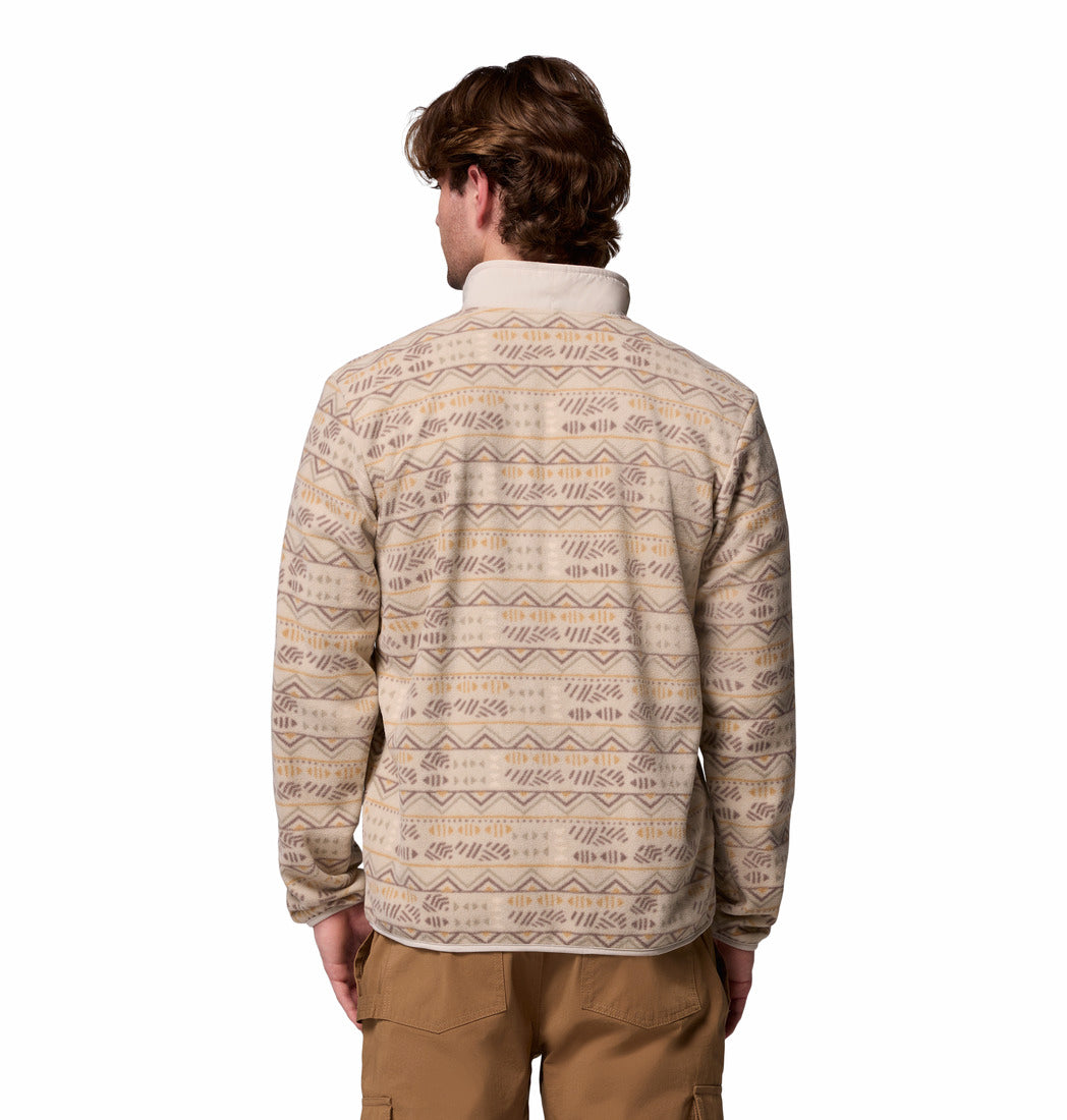 Man wearing a patterned beige jacket on a white background