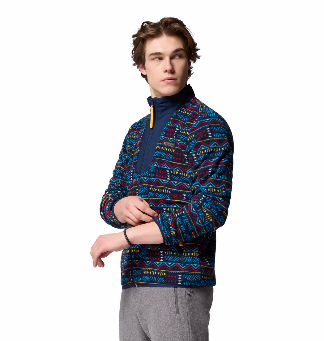Person wearing a patterned blue jacket on a white background