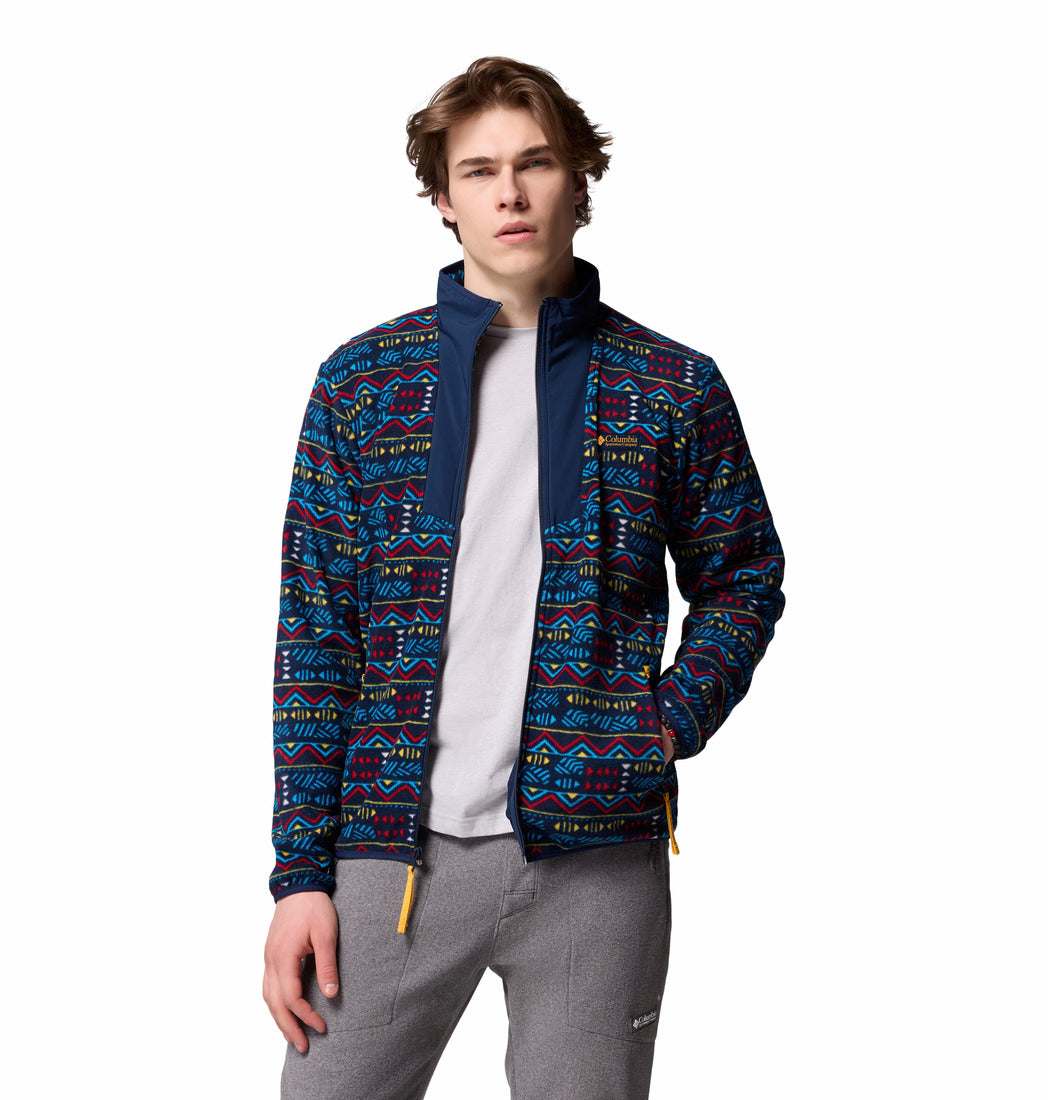 Person wearing a patterned jacket on a white background
