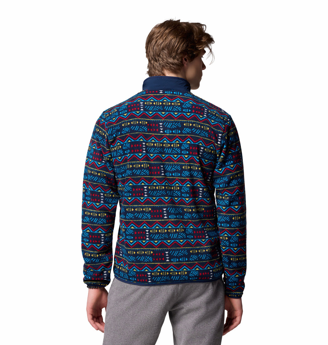 Person wearing a patterned jacket on a white background