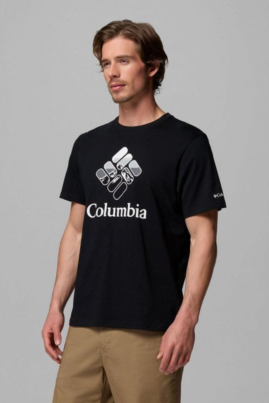 Man wearing a black Columbia t-shirt against a gray background