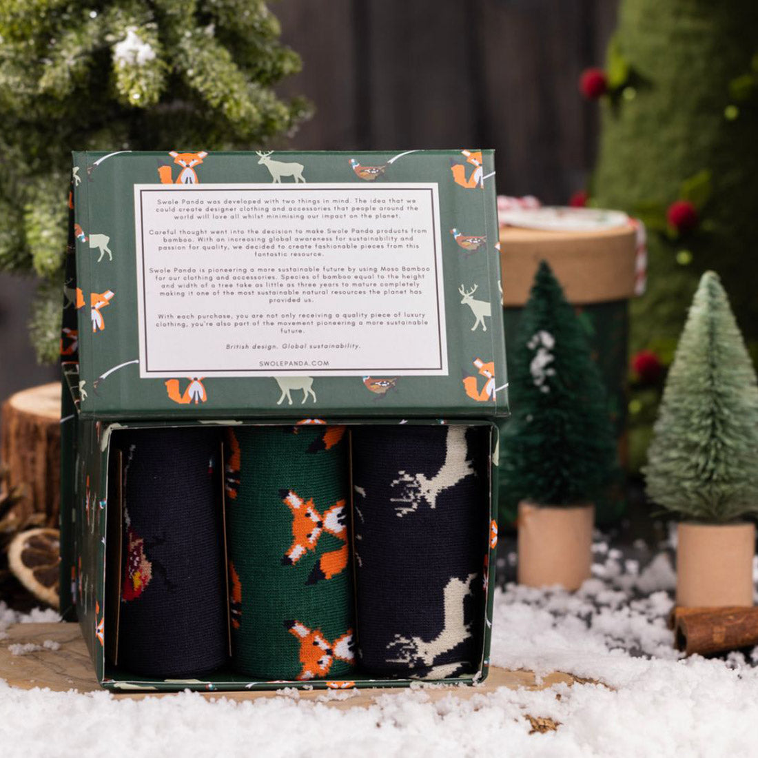 One pair each of Foxes, Stags and Pheasants socks in a gift box in a christmas scene