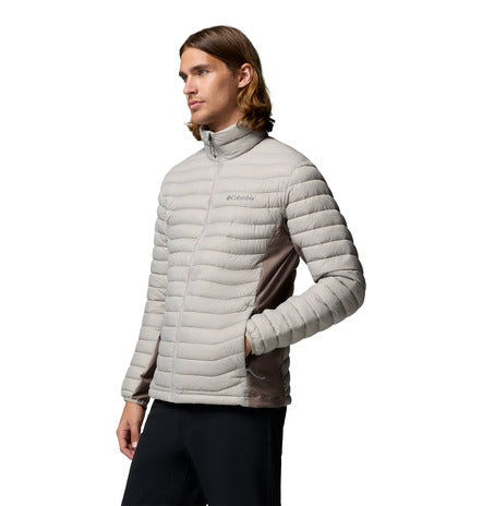 Person wearing a light gray puffer jacket on a white background