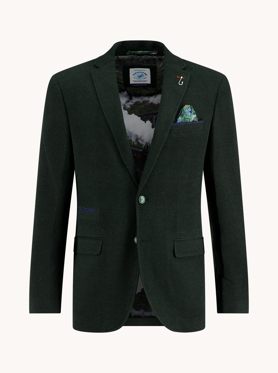 Dark green blazer with a patterned pocket square on a white background