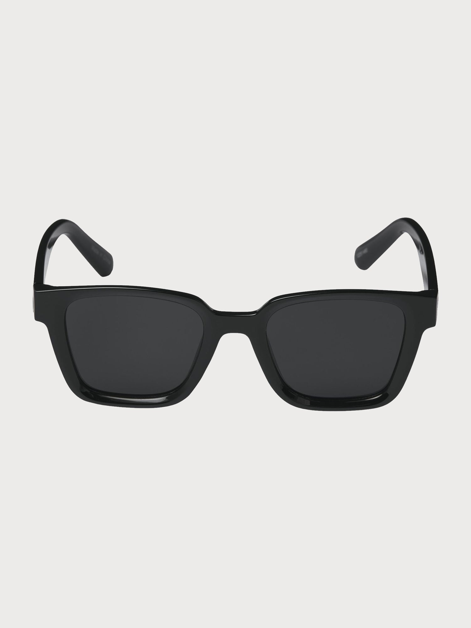 Pontus Sunglasses - Black sunglasses on a light gray background