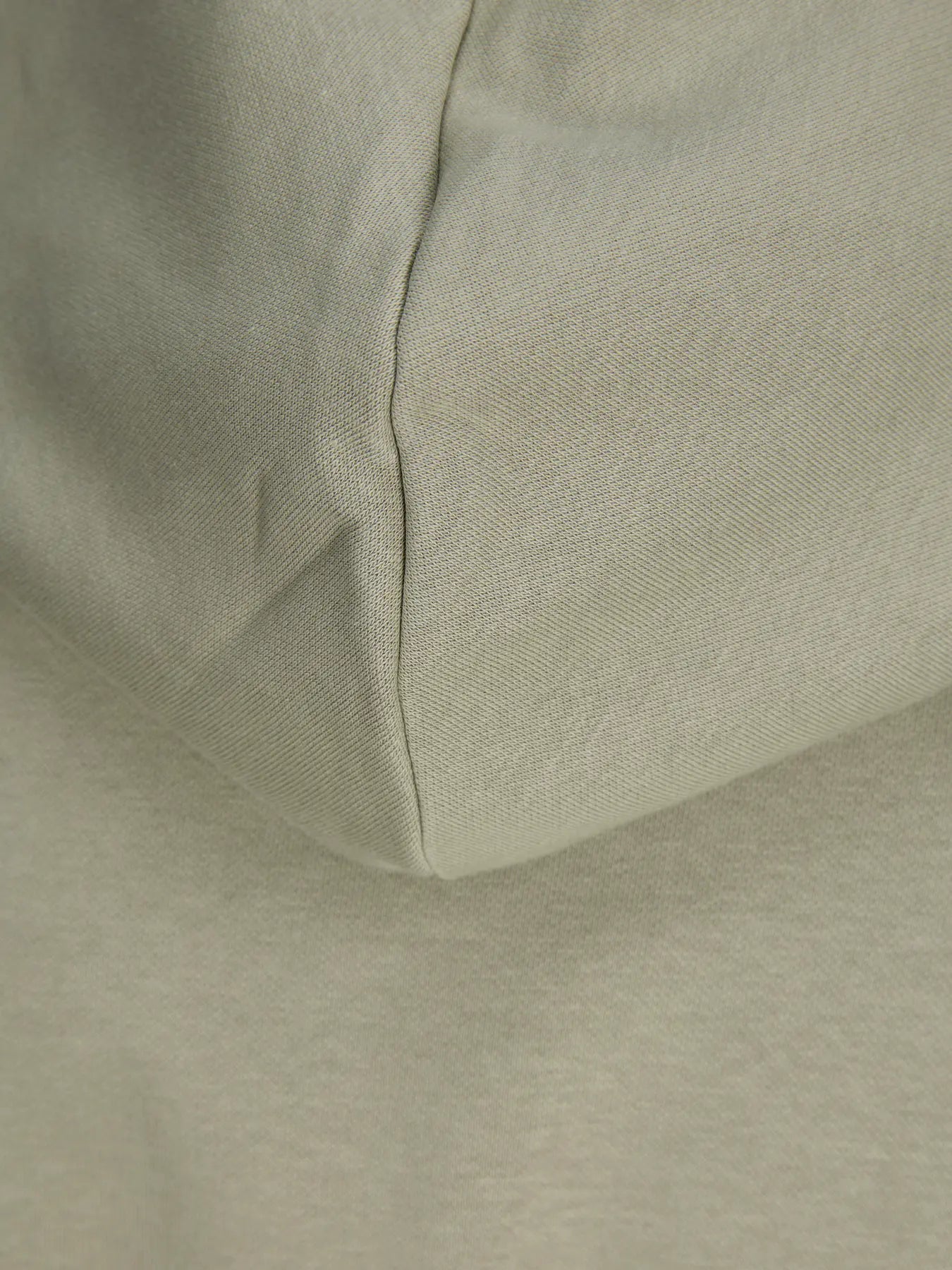 Close-up of a light green fabric texture