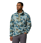 Man wearing a patterned pullover on a white background