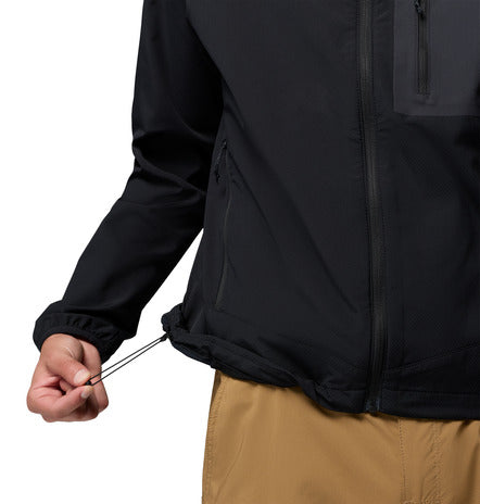 Close-up of a person wearing a black jacket with a zipper, on a white background