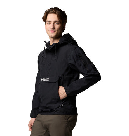 Man wearing a black Columbia jacket on a white background