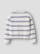 White sweater with purple stripes on a grey background