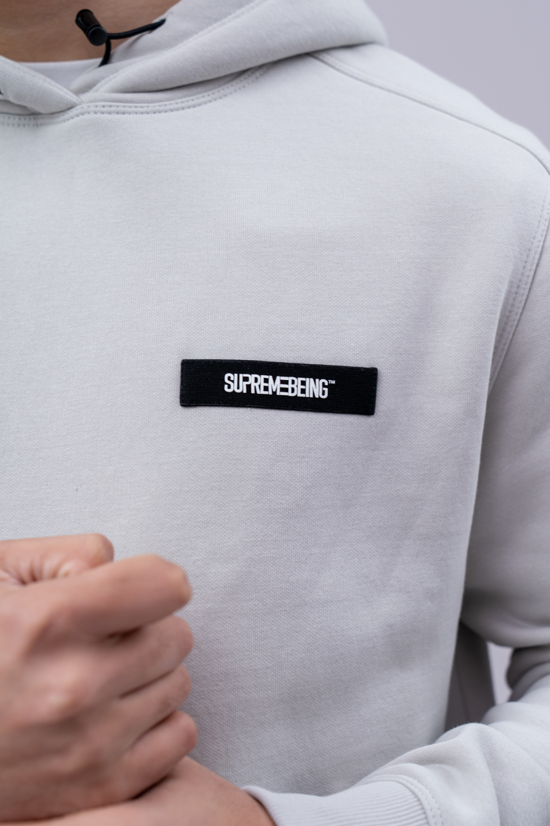 Supreme Being Diego Hood Powder Grey, logo view view