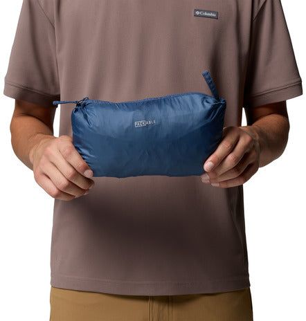 Person holding a blue Columbia packer pouch wearing Columbia logo on a brown shirt