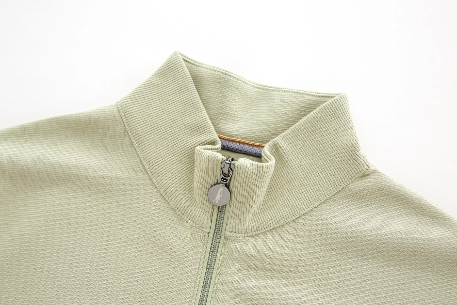 Close-up of Belter moss 1/4 Zip with a zipper on a white background