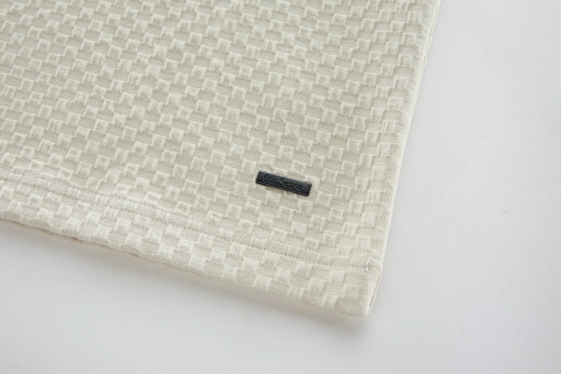 Textured fabric with a woven pattern on a white background
