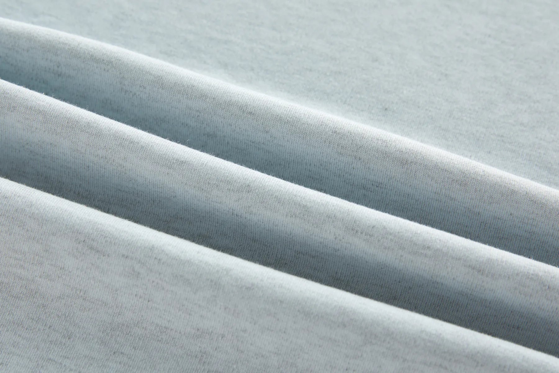 Close-up of light blue fabric with subtle texture