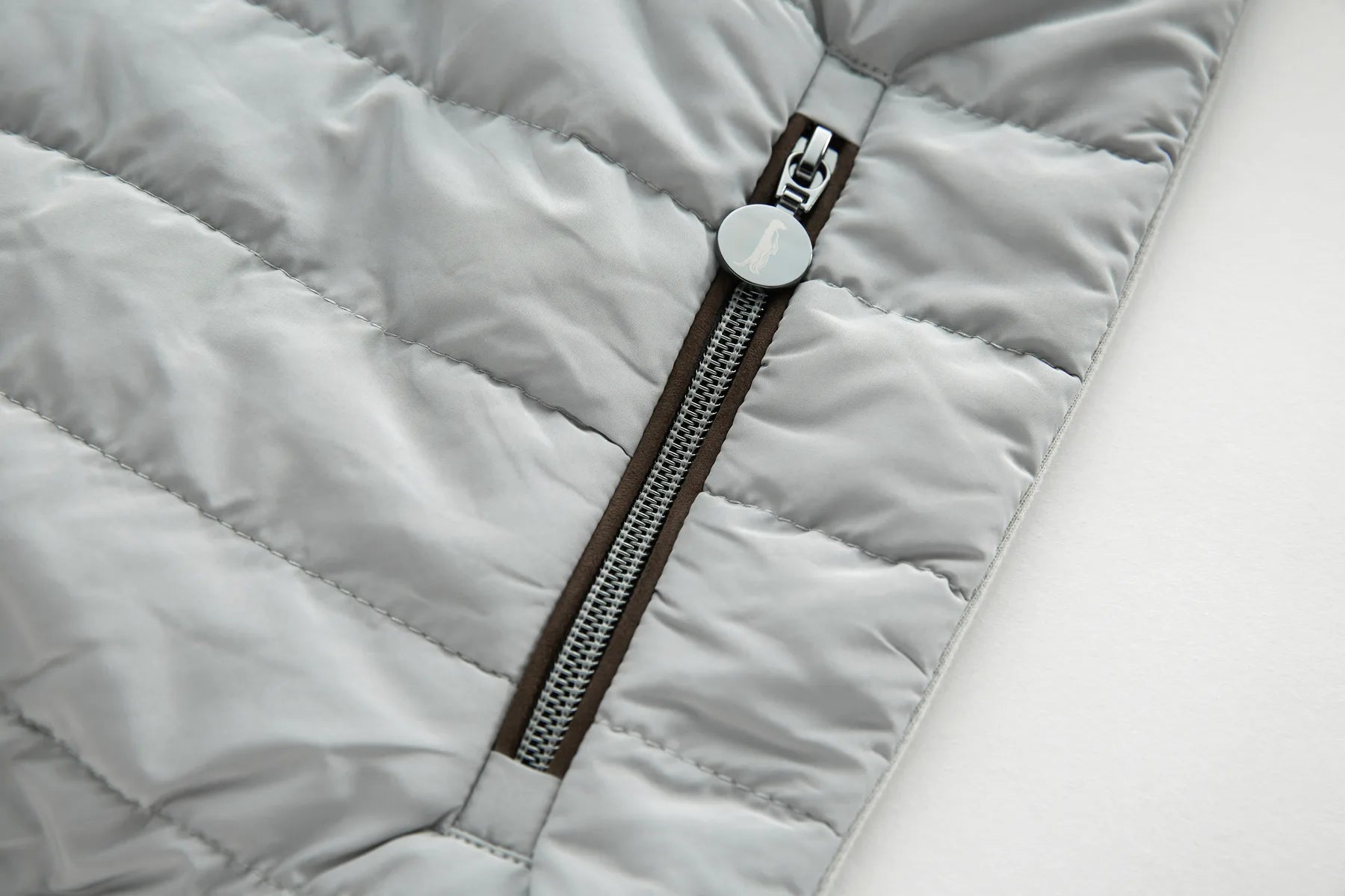 Close-up of a Sammy Full Zip Drizzle Jacket with a zipper pocket