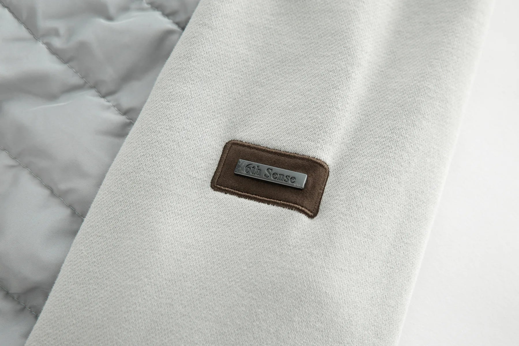 Close-up of a textured fabric surface on Sammy Full Zip Drizzle Jacket