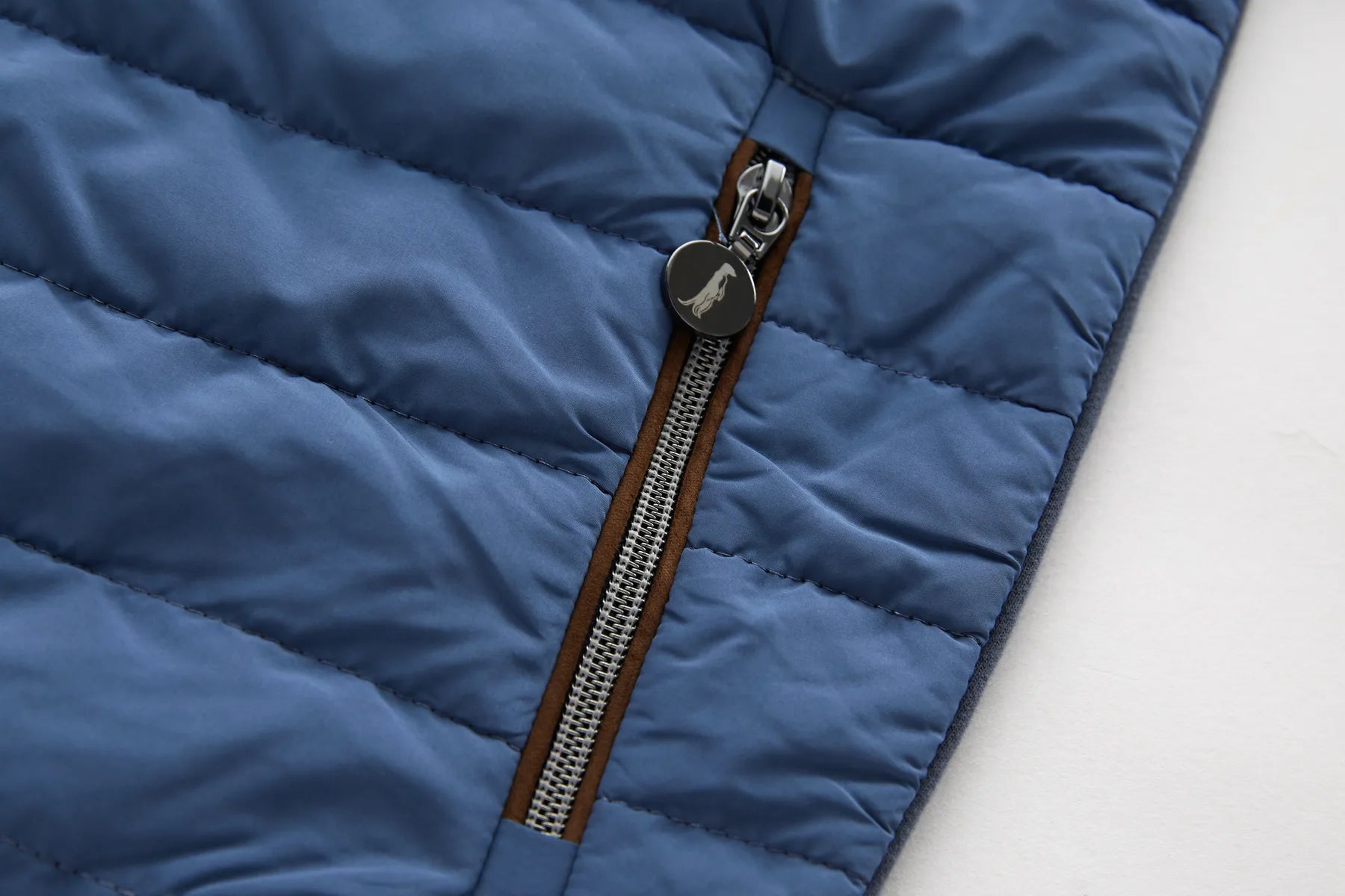 Close-up of a Sammy full zip turbulence jacket with a pocket zipper on a white background
