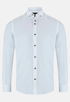 White dress shirt with navy tan buttons on a white background