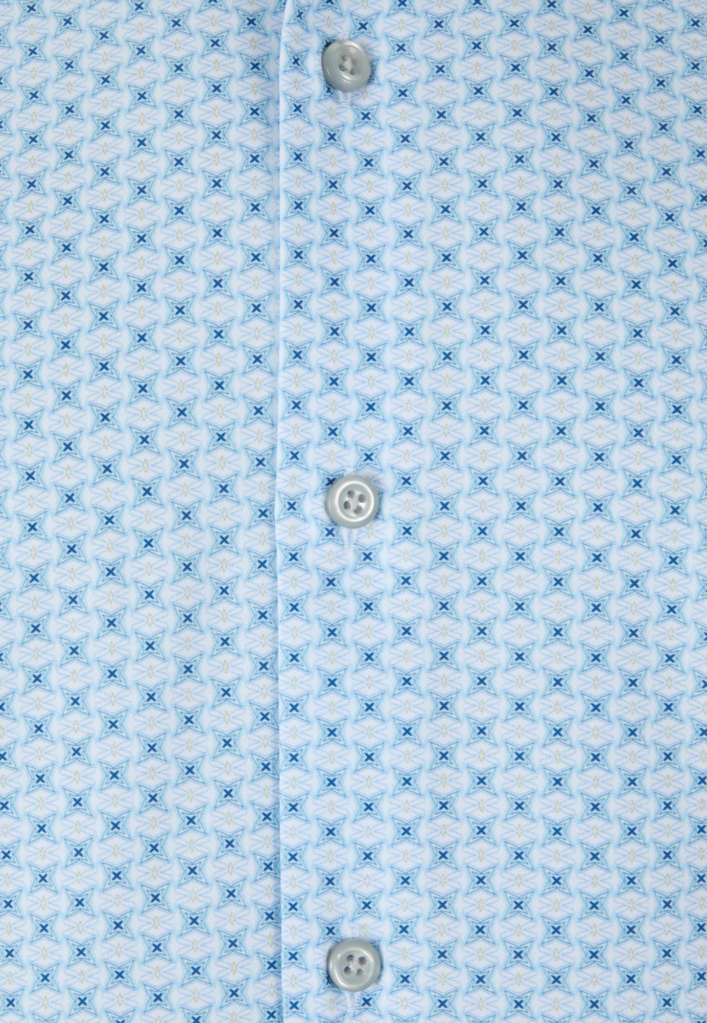 Close-up of a light blue shirt with a subtle pattern and button details.